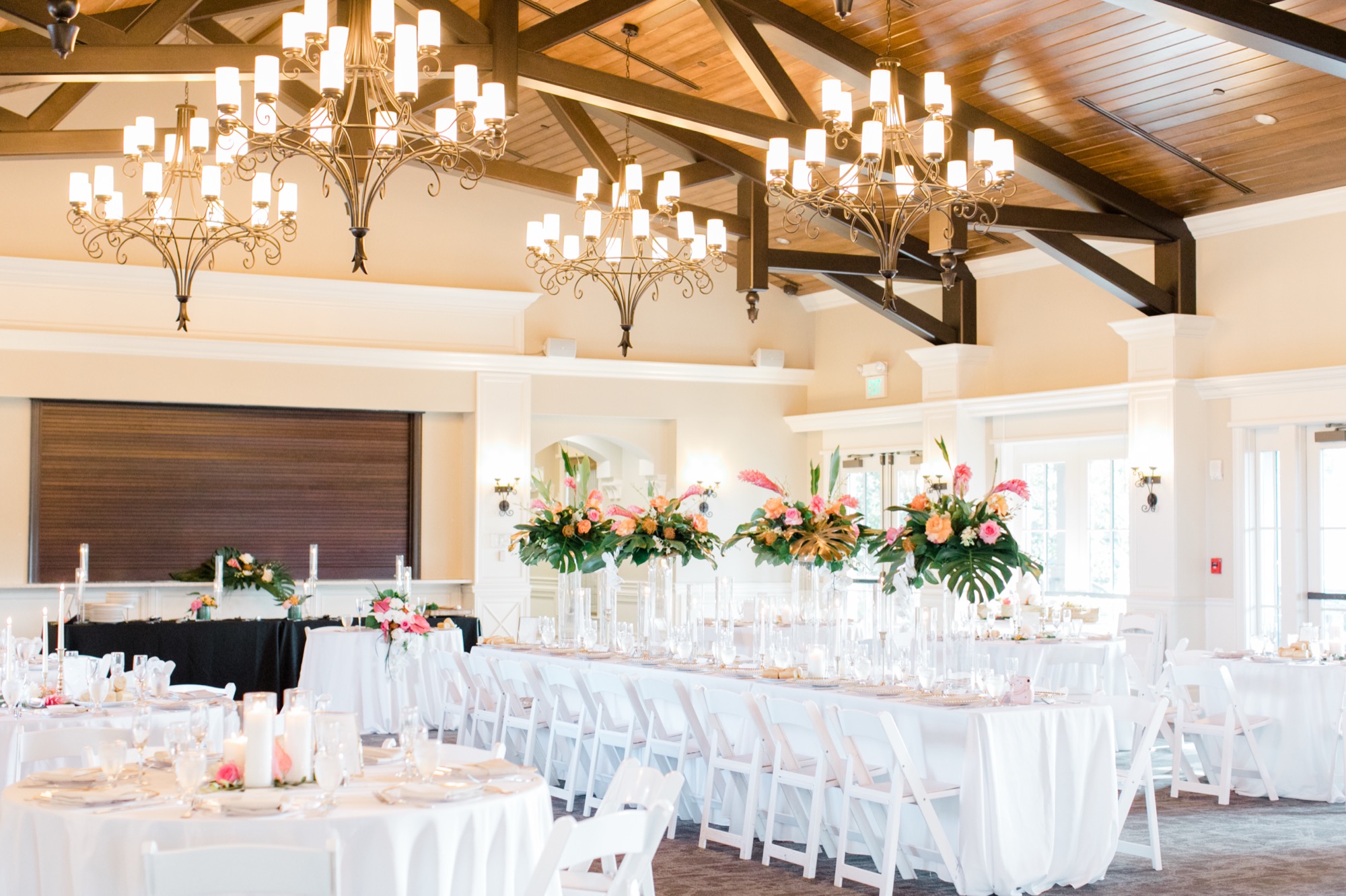 Crosswater Hall interior with vaulted wood-beam ceilings and chandeliers